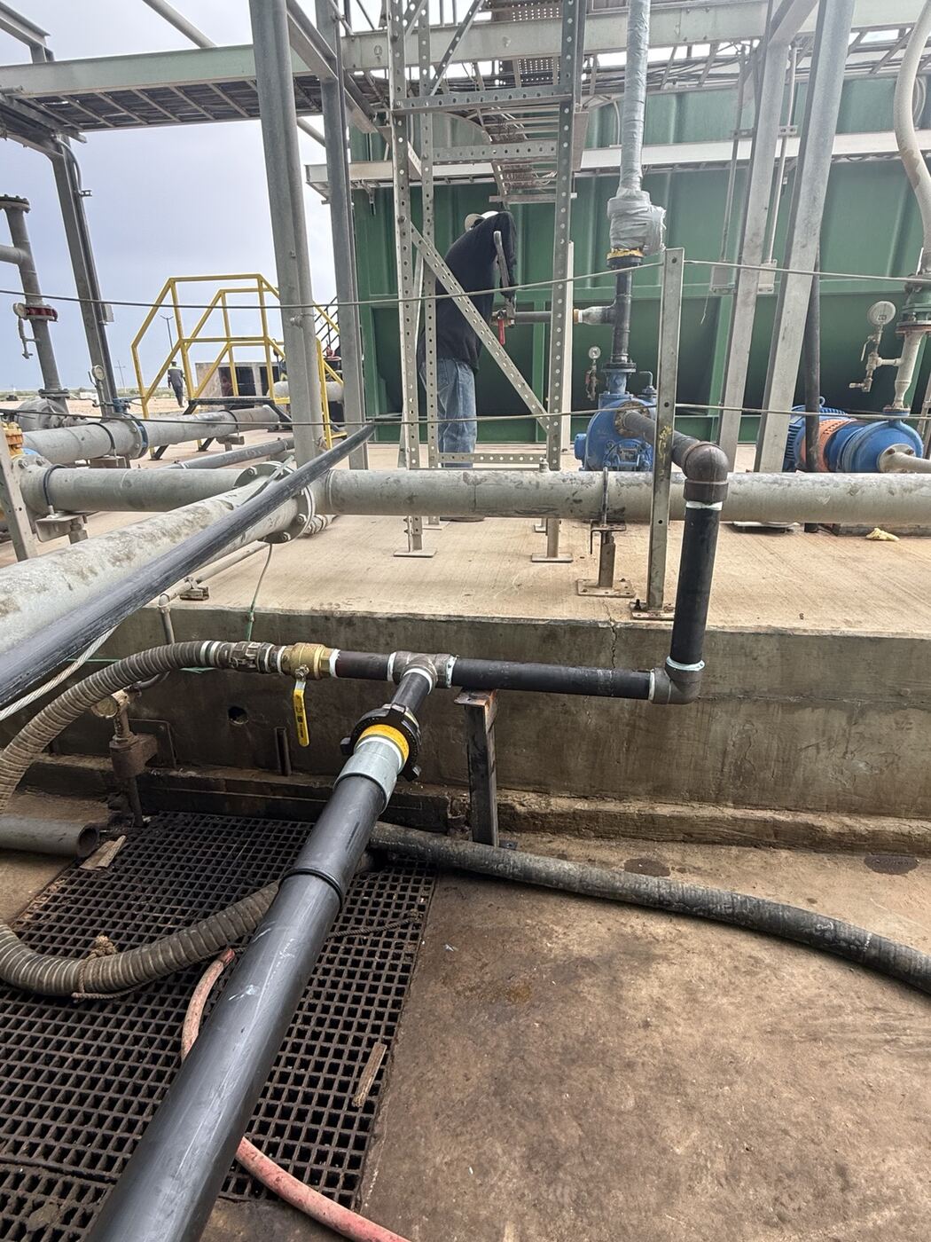Temporary piping installed at an oil and gas production facility