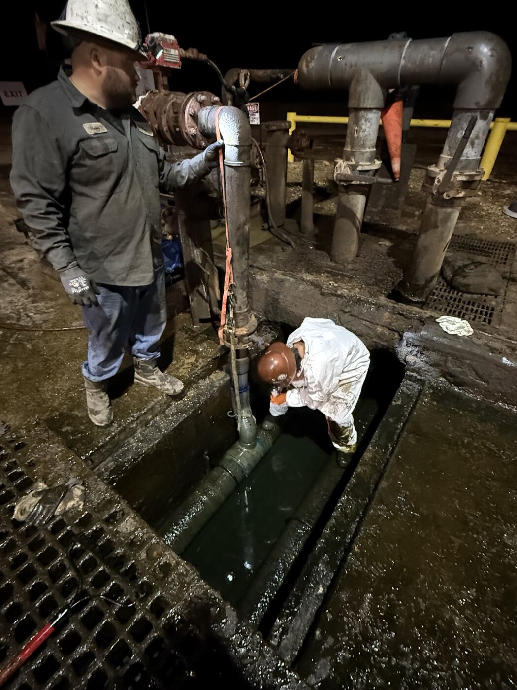 Crew completing field service work at night